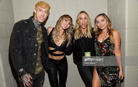 A picture of Tish Cyrus with her kids; Trace Cyrus (left), Miley Cyrus (second from left) and Brandi Cyrus (right).